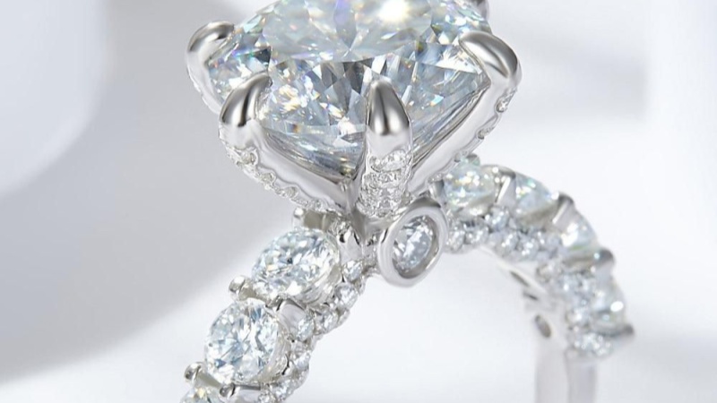 It is a natural gemstone with lower brilliance compared to diamonds.