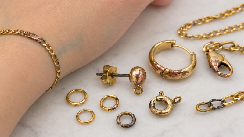 Base metals behave differently when the gold layer becomes thin or worn.