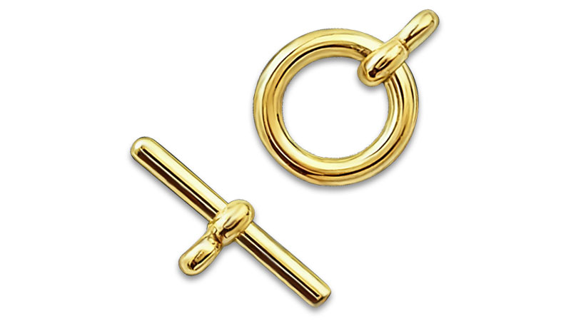 A gold toggle clasp for jewelry.