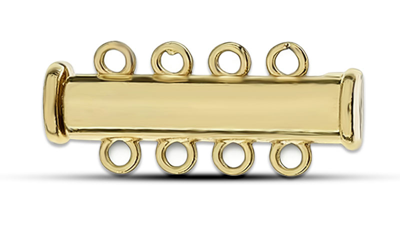 A gold slide clasp for multi-strand jewelry.