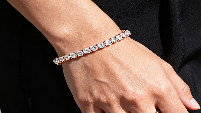 The tennis bracelet is set with multiple gemstones