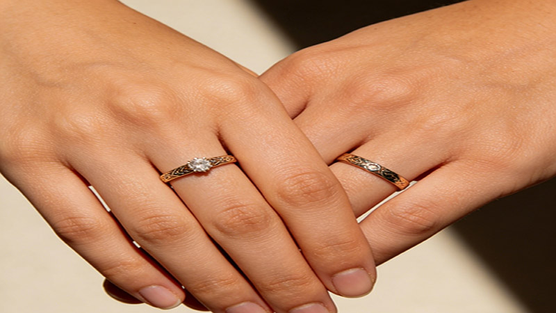  the engagement ring is worn on the left hand, and the wedding ring is worn on the right hand.