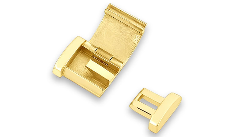 A gold box clasp for jewelry.