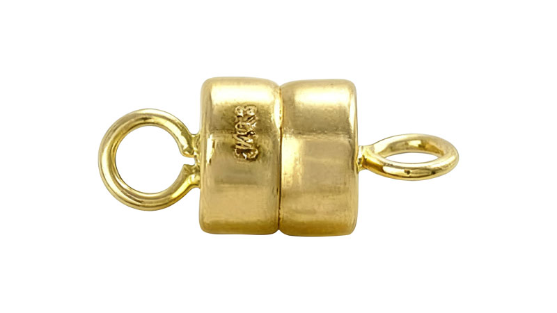 A gold magnetic clasp for jewelry.