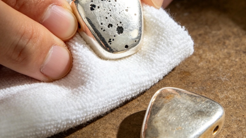 Silver tarnish comes from a reaction with hydrogen sulfide in the air.